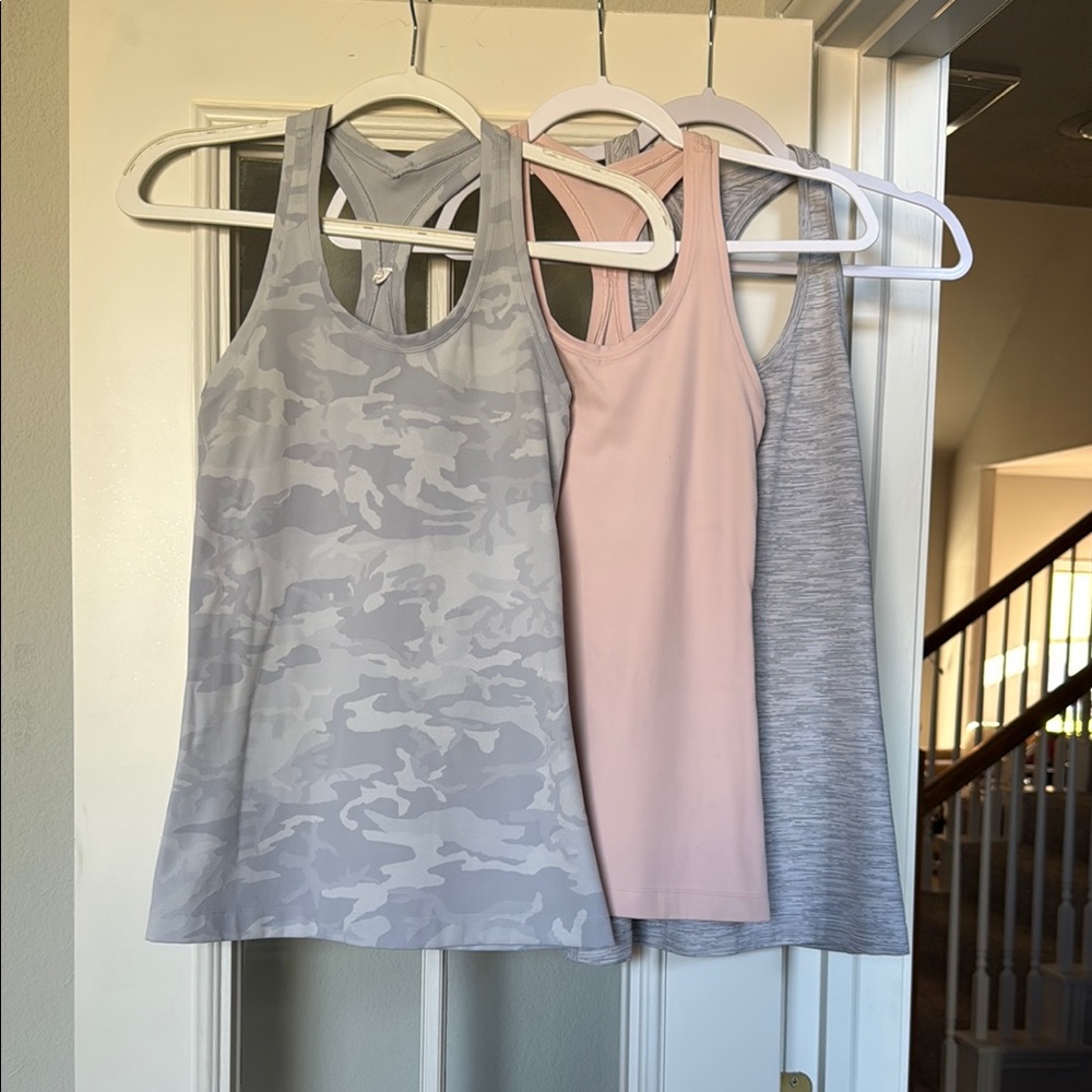 Lululemon size six Women's Gray, Pink, and Gray Camo Tank Tops!